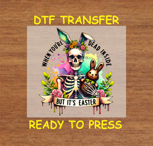 Skeleton wearing bunny ears with a chocolate bunny, colorful splashes, and flowers.