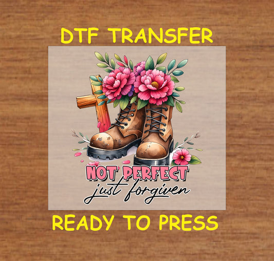 Christian DTF transfer with boots, flowers, a wooden cross, and "Not Perfect, Just Forgiven" text.