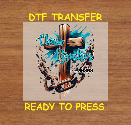 Wooden cross with broken chains and "Chain Breaker #Jesus" text in a Christian DTF transfer.