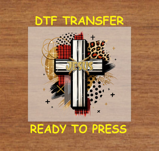 Grunge-style cross with "Jesus" text, plaid, leopard print, and abstract accents.