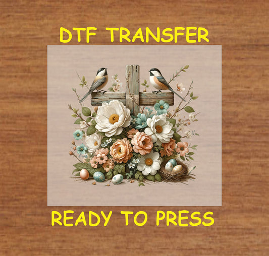 Rustic wooden cross with flowers, birds, and Easter eggs in a Christian DTF transfer.