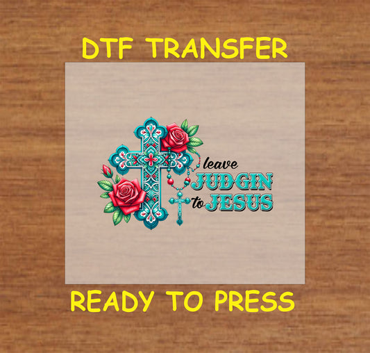 Ornate turquoise cross with red roses, rosary, and "Leave Judgin to Jesus" text.