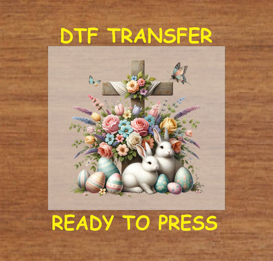 Rustic wooden cross with pastel flowers, butterflies, bunnies, and decorative Easter eggs.