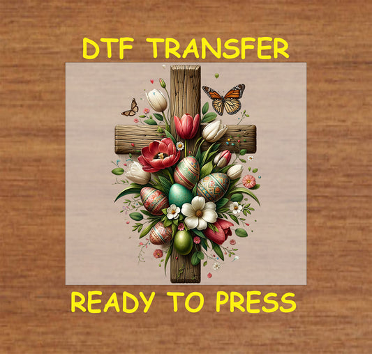 Rustic wooden cross decorated with tulips, spring flowers, and Easter eggs.