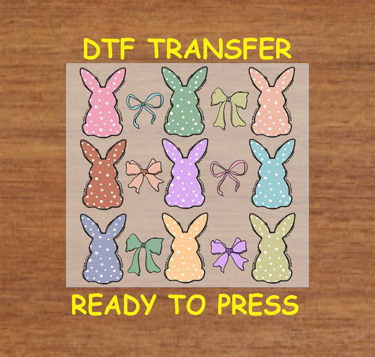 DTF transfer with 12 pastel polka dot bunnies and matching bows.