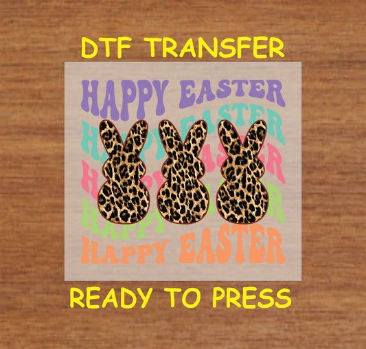 Easter DTF transfer featuring three leopard print bunnies with colorful "Happy Easter" text.