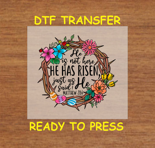He Has Risen Easter DTF transfer with a crown of thorns, flowers, and Matthew 28:6 verse.