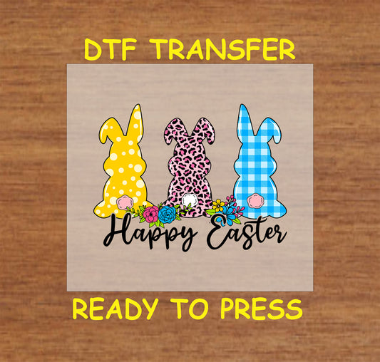 DTF transfer featuring three bunnies in polka dot, leopard, and gingham patterns with spring flowers.