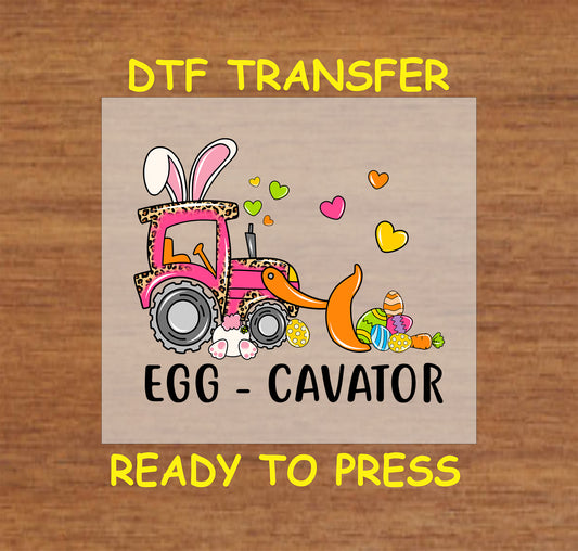 DTF transfer with a pink leopard print excavator, bunny ears, and Easter eggs, with "Egg-Cavator" text.