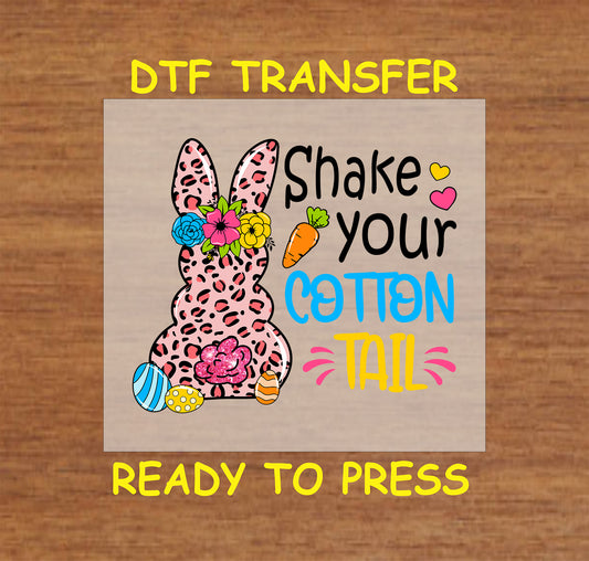 DTF transfer with a leopard bunny, flowers, Easter eggs, and "Shake Your Cotton Tail" text.