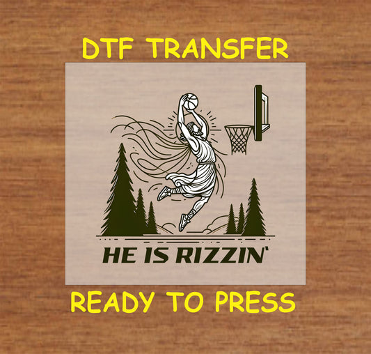Jesus dunking a basketball with "He Is Rizzin" text, DTF transfer.