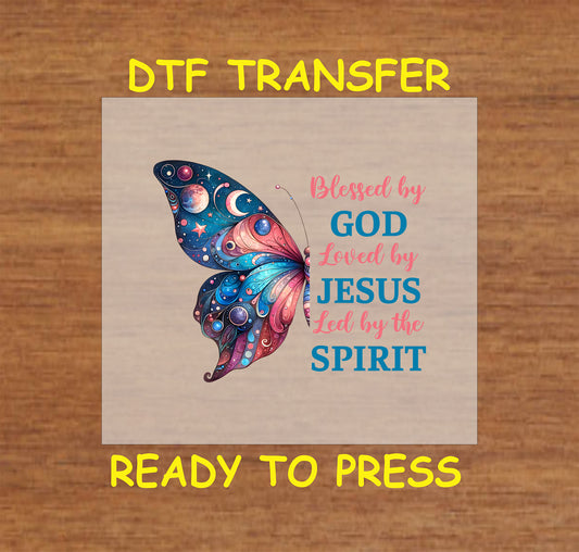Colorful celestial butterfly with "Blessed by God, Loved by Jesus, Led by the Spirit" text.