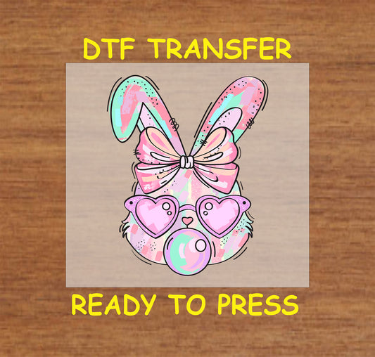 Pastel bunny with heart sunglasses, pink bow, and bubble gum pop.