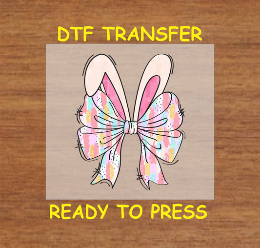 Pastel watercolor bow with bunny ears in a soft Easter design.