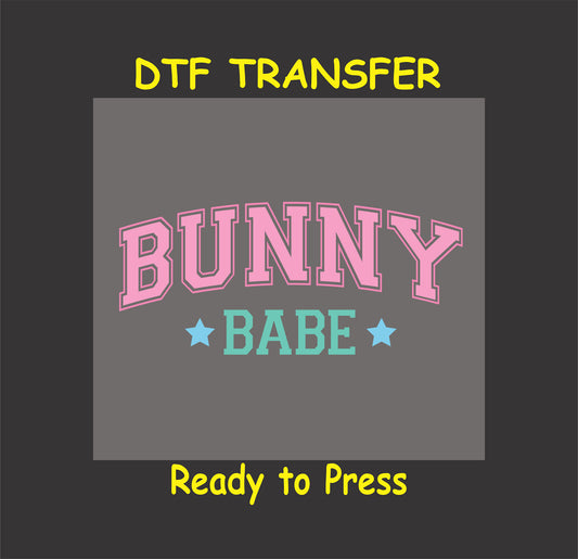 Bold varsity-style "Bunny Babe" text in pink and blue with stars.
