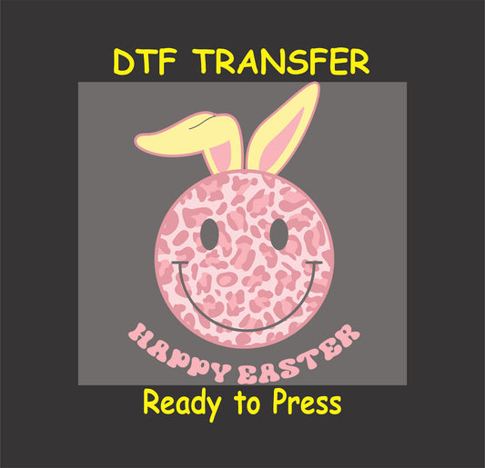 Pink leopard-print smiley face with bunny ears and "Happy Easter" text, DTF transfer.