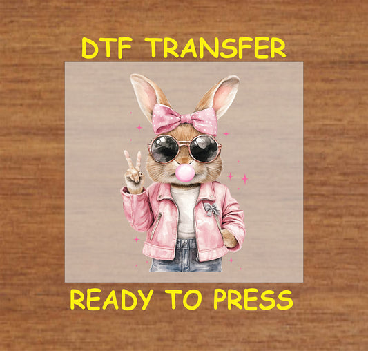 Trendy bunny DTF transfer, bunny with sunglasses, bubblegum, and pink jacket, ready to press.