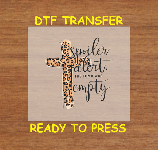 Leopard print cross with "Spoiler Alert: The Tomb Was Empty" text, faith-based Easter DTF transfer.