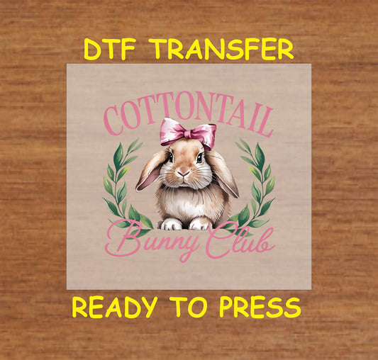 Realistic bunny with a pink bow, greenery, and "Cottontail Bunny Club" text, DTF transfer.