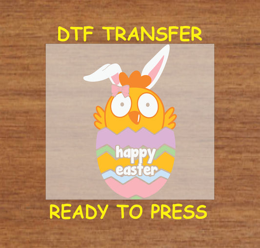 Cute baby chick in an eggshell with bunny ears and a bow, Happy Easter DTF transfer.