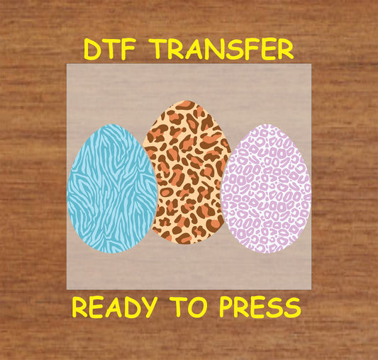 Three Easter eggs with zebra, leopard, and cheetah prints, DTF transfer.