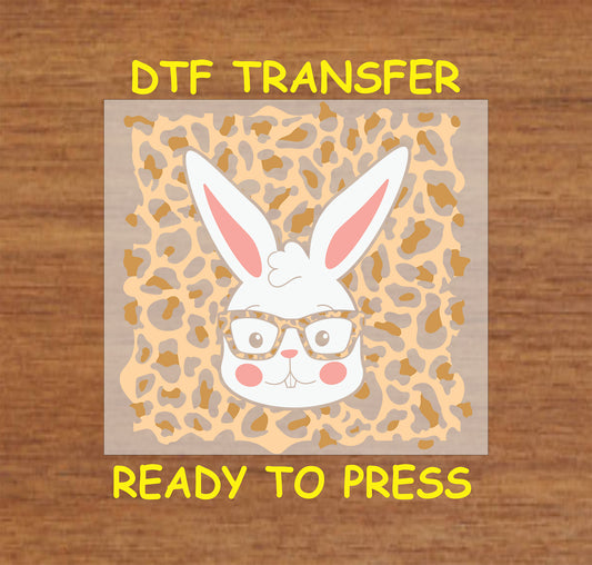 White bunny with leopard print glasses on a leopard background, DTF transfer.