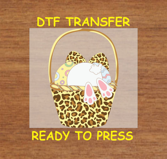 Bunny diving into a leopard print Easter basket filled with colorful eggs, DTF transfer.