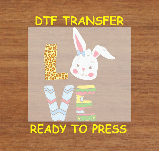 LOVE Easter Bunny DTF transfer with leopard print L, bunny head, and pastel egg letters.