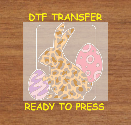 Leopard print Easter bunny DTF transfer with pink patterned Easter eggs.