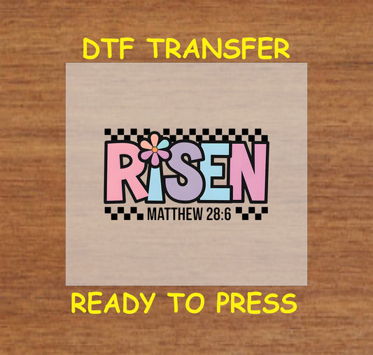 Pastel "Risen" text with Matthew 28:6 scripture, flower detail, and checkered border.