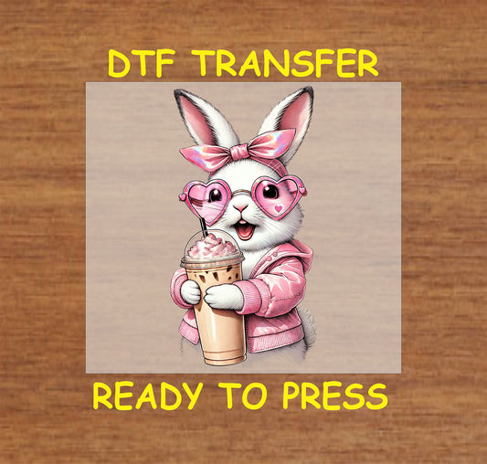 White bunny with heart sunglasses, pink bow, and coffee cup.