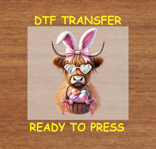 Highland cow with bunny ears, sunglasses, and an Easter basket.