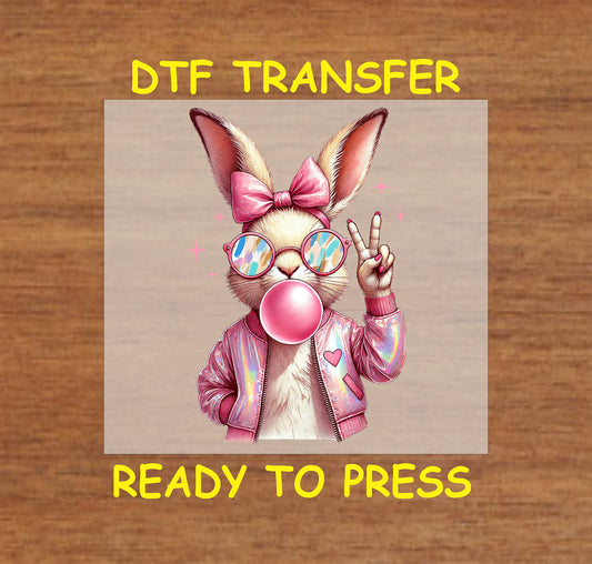 Trendy Easter bunny wearing sunglasses, a bow, and a pink jacket, blowing bubble gum.