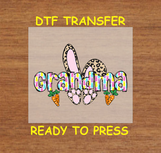 Grandma Easter Bunny DTF transfer with colorful bunny-patterned letters, leopard print bunny ears, and carrots.