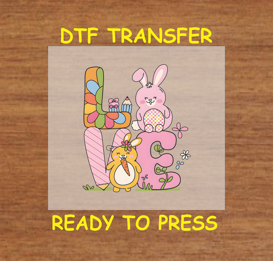 Easter Love DTF transfer with colorful letters, bunnies, carrot, and flowers.
