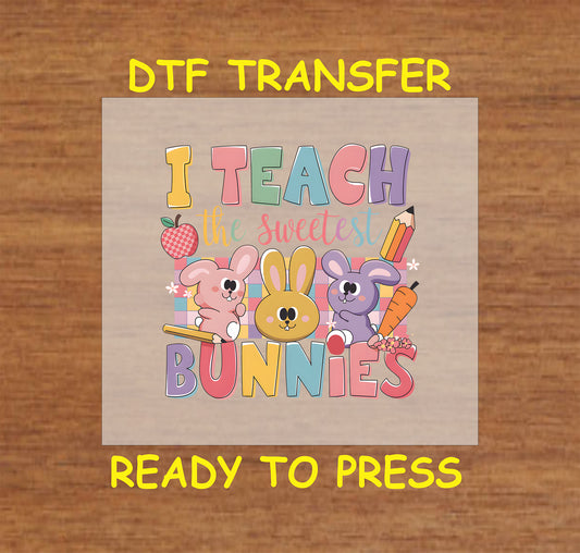 I Teach the Sweetest Bunnies DTF transfer with pastel bunnies, pencils, and a colorful Easter design.