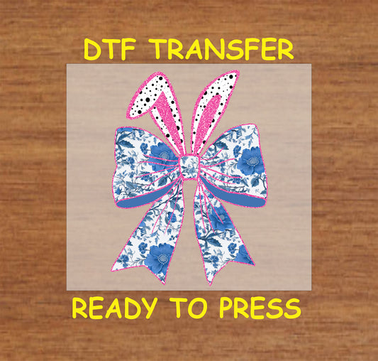 Blue floral bow DTF transfer with pink sparkle accents for Easter and spring designs.