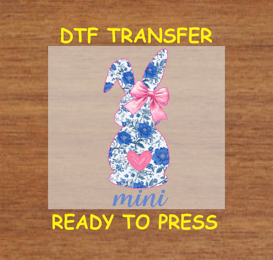 Mini floral bunny DTF transfer with blue flowers, pink bow, and heart, perfect for Easter and spring designs.