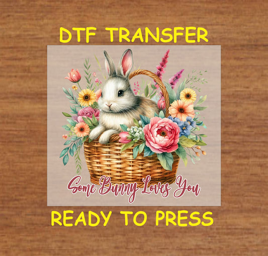 Easter Bunny in a floral basket with Some Bunny Loves You text.