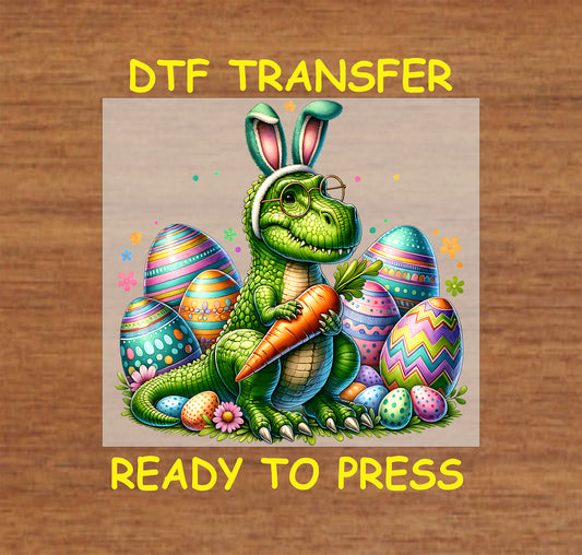 Green dinosaur wearing bunny ears and glasses, holding a carrot, surrounded by colorful Easter eggs.