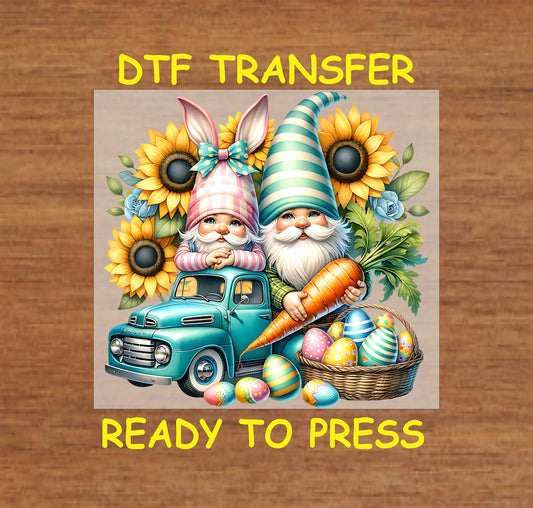 Easter gnomes with bunny ears on a teal truck, sunflowers, a large carrot, and colorful eggs.