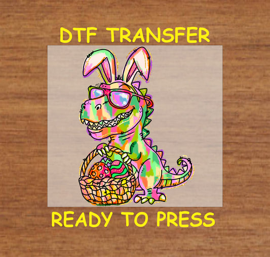 Colorful Easter Dinosaur DTF transfer featuring a T-Rex with bunny ears, sunglasses, and an Easter basket.