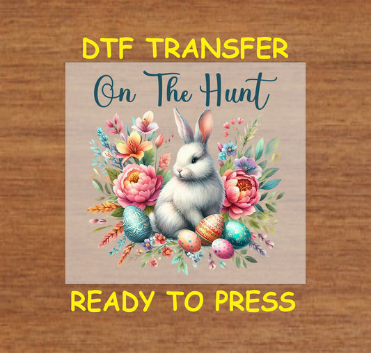 Easter Bunny DTF transfer with colorful flowers, decorated eggs, and "On The Hunt" text.