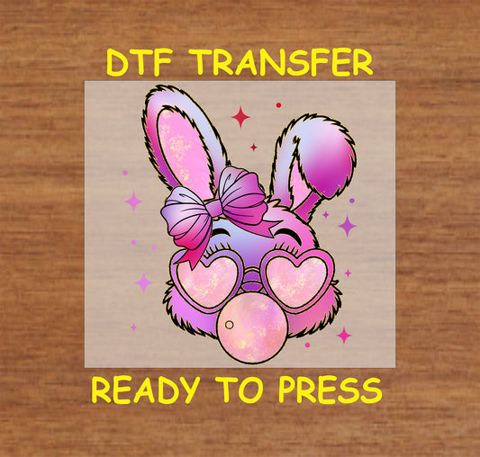 Easter DTF transfer featuring a glittery bunny with heart sunglasses, a bow, and a bubblegum bubble.