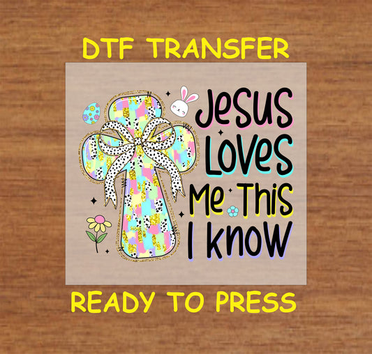 Easter DTF transfer with a patterned cross, bow, and "Jesus Loves Me This I Know" text.