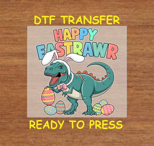 Easter DTF transfer with a T-Rex wearing bunny ears, holding eggs, and "Happy Eastrawr" text.