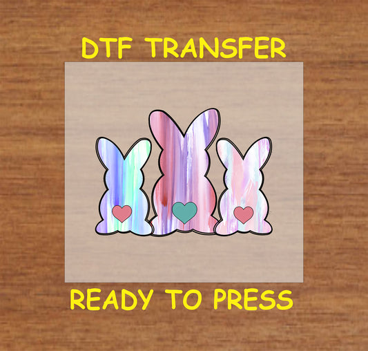 Three pastel bunnies with heart accents in a watercolor style.