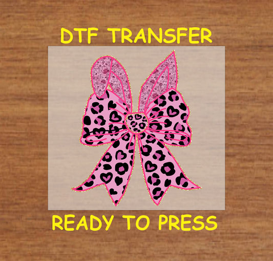 Pink leopard print bow with bunny ears and heart accents.