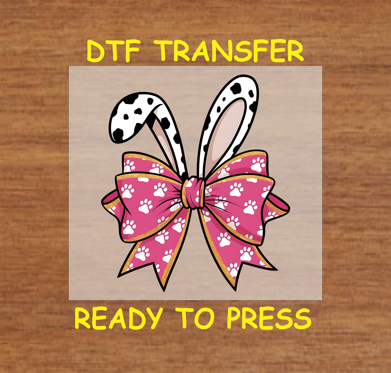 Dalmatian bunny ears with pink bow and paw print pattern.