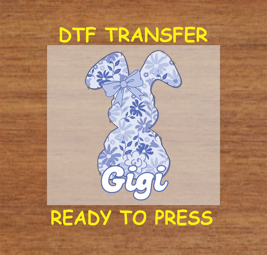 Blue floral Easter bunny DTF transfer with "Gigi" text and a bow.